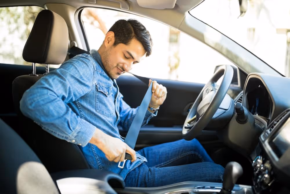 Man fastening seatbelt